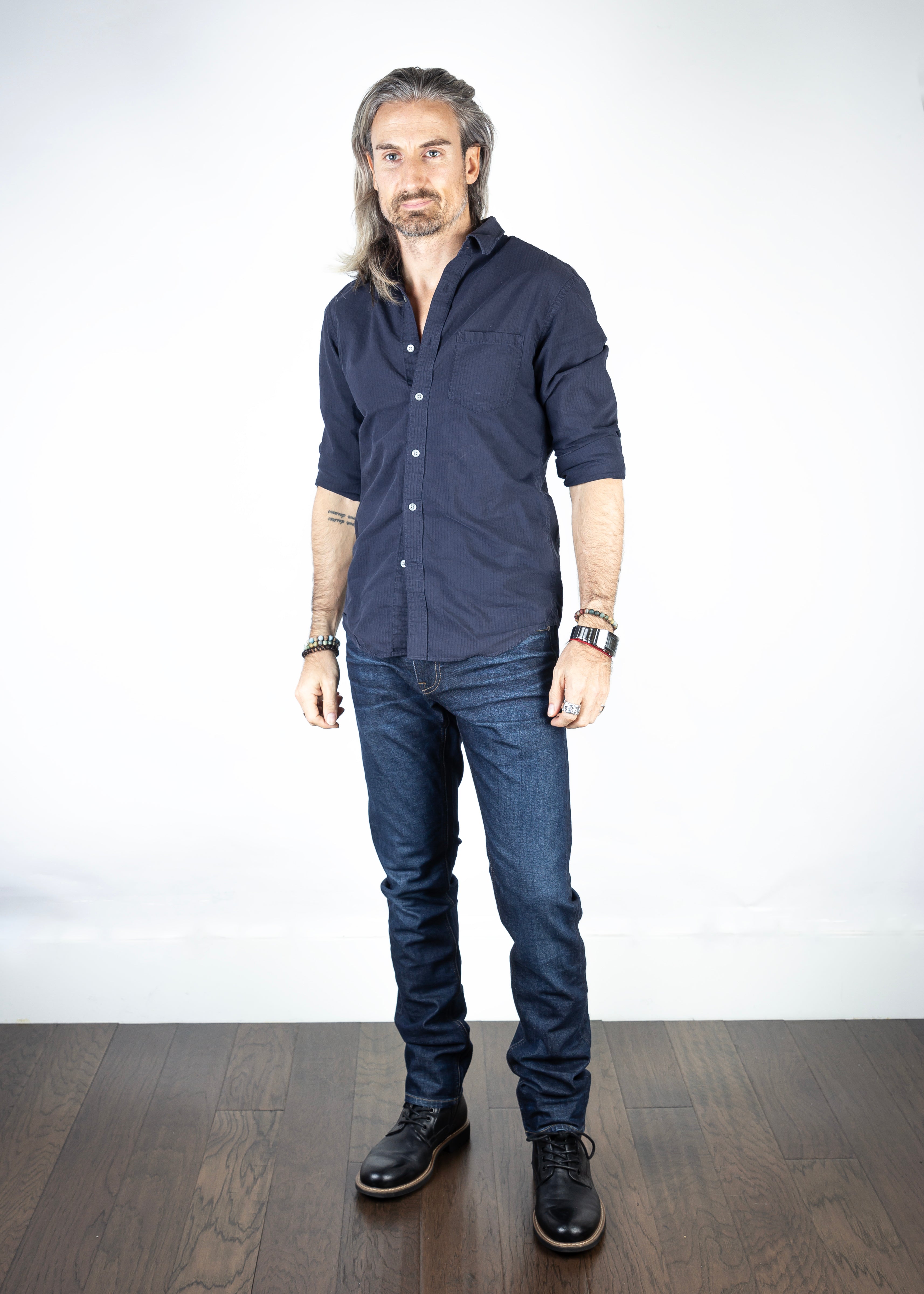 Model wearing the Axe Fuse Slim Straight Comfort Fit Jeans, front-facing, highlighting their slim straight fit and sleek Italian denim craftsmanship.