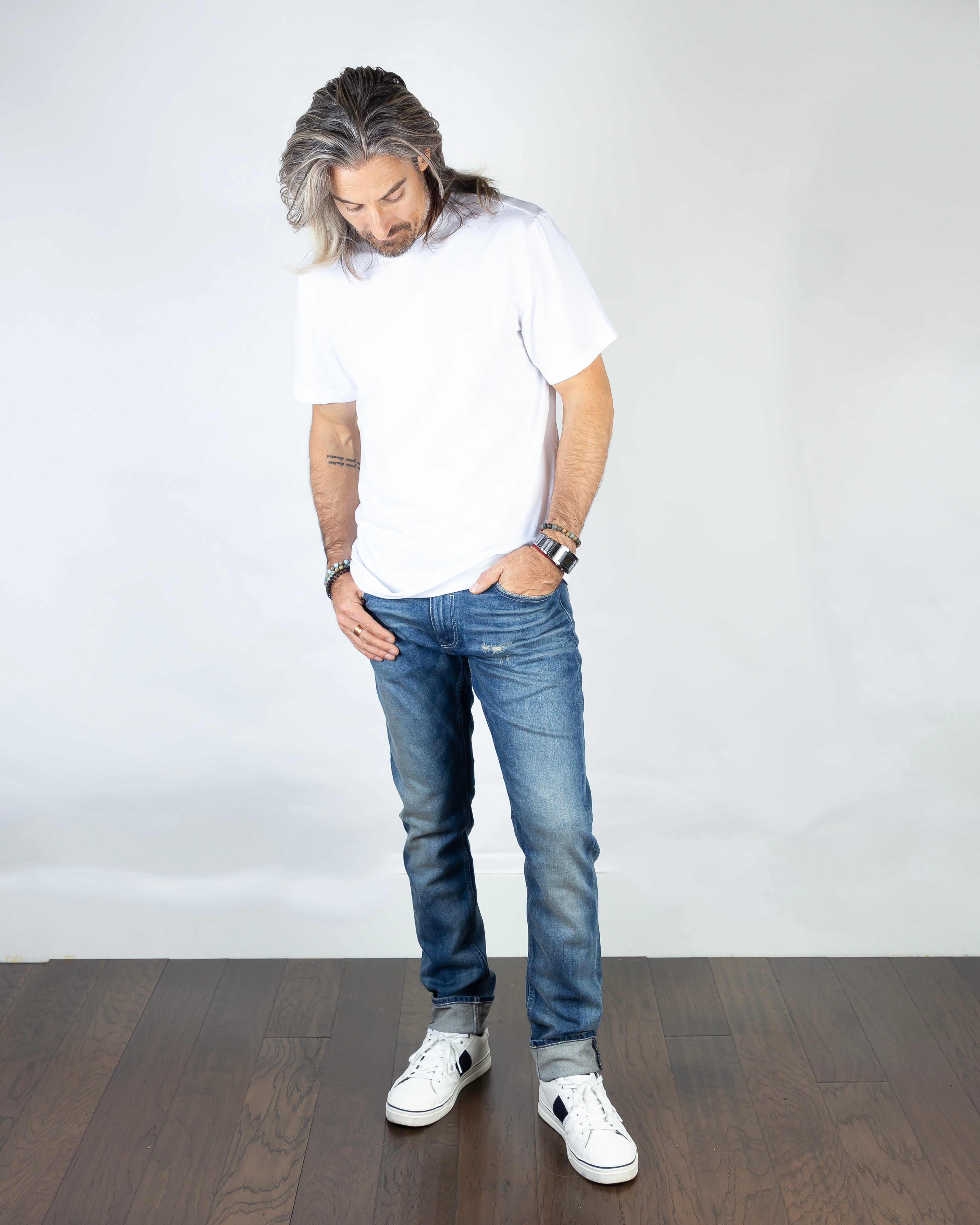 Model wearing Axe Lazuli Slim Straight Comfort Fit Jeans front view, featuring a timeless artisan-crafted design.