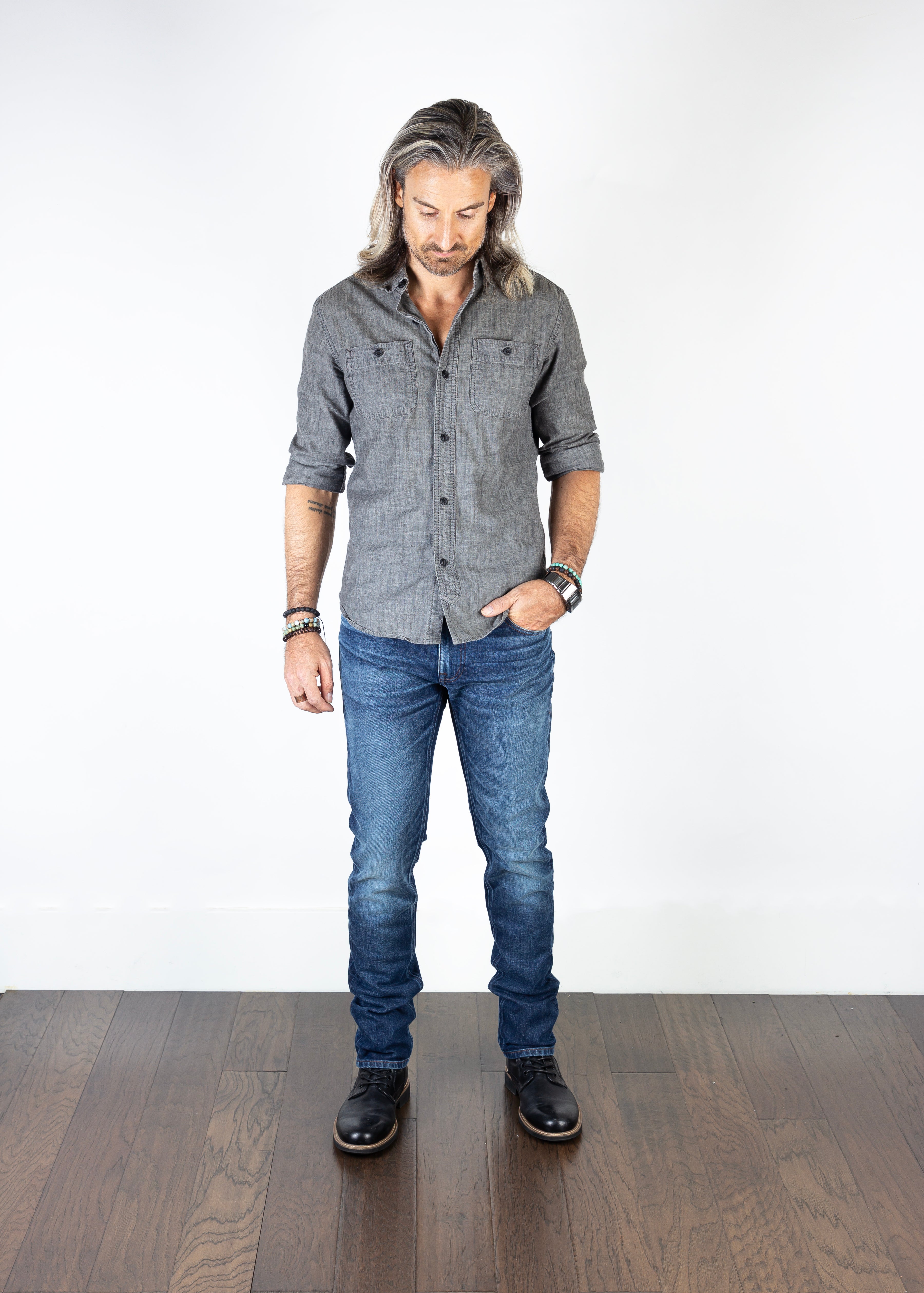 Model wearing the Axe Oxford Slim Straight Comfort Fit Jeans, front-facing, showcasing their slim straight fit, premium craftsmanship, and sustainable Italian denim.
