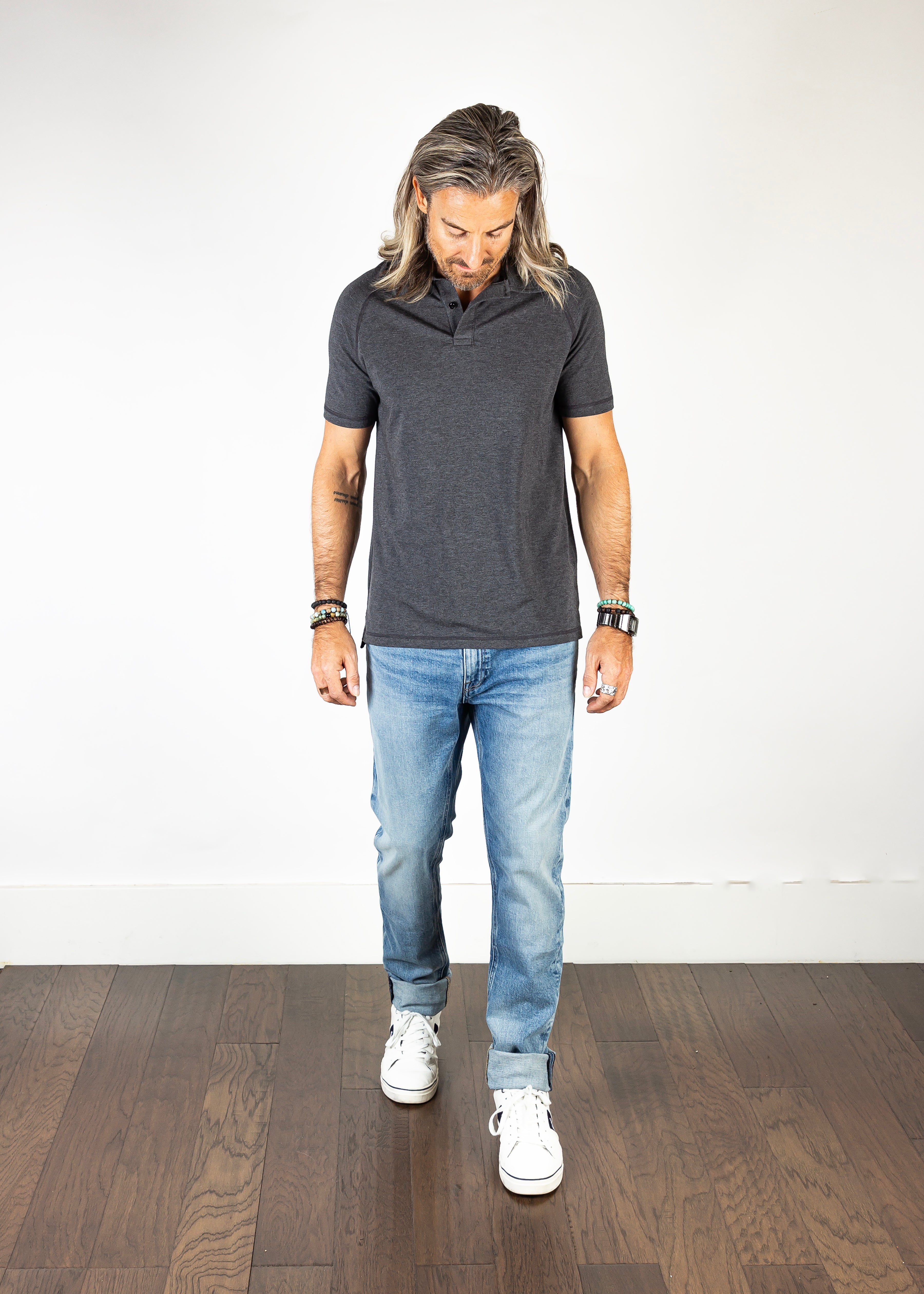 Model wearing the Axe Vintage Slim Straight Comfort Fit Jeans, front-facing, showcasing their slim fit, classic 10-year aged look, and eco-friendly craftsmanship.