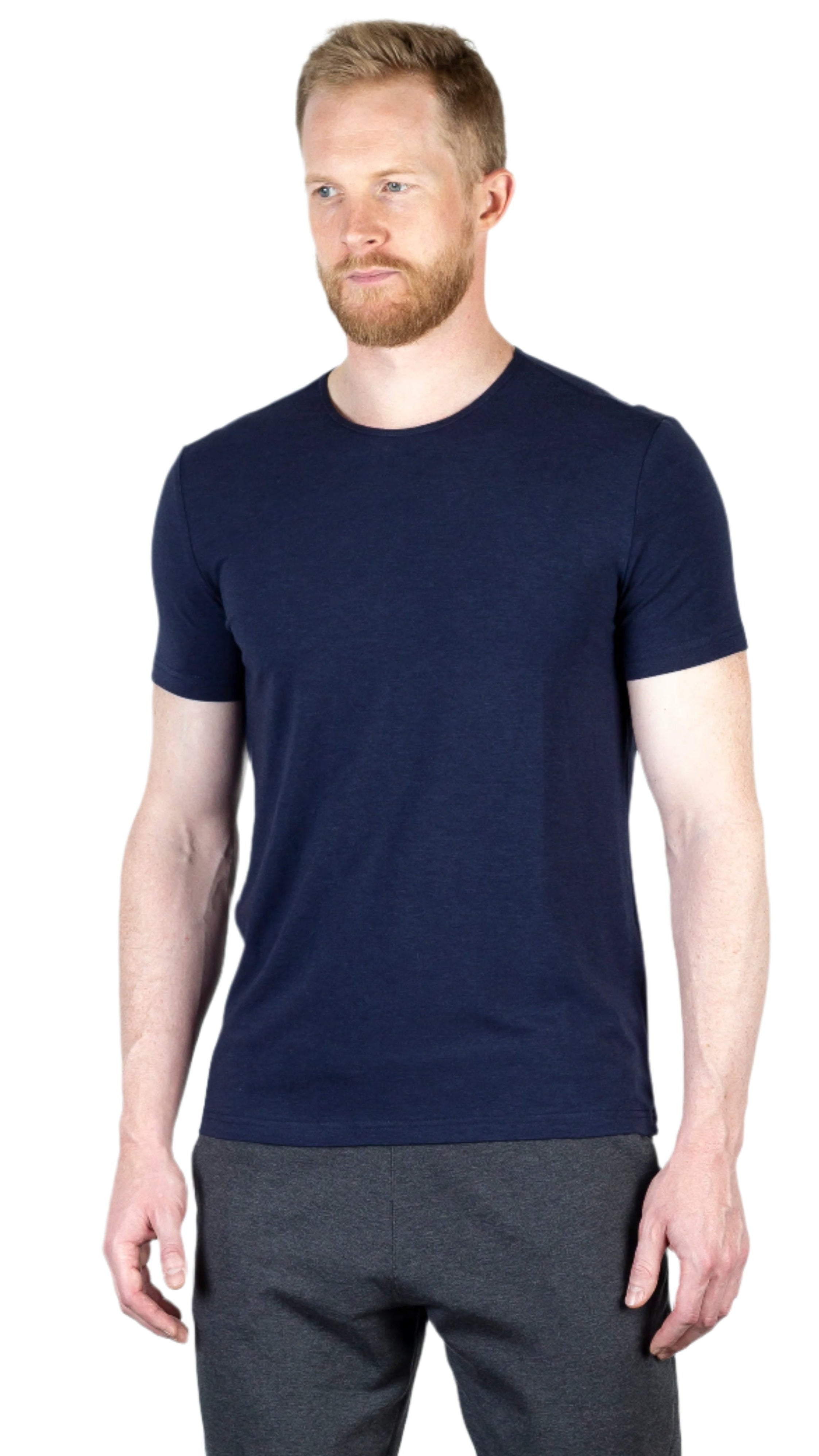 Model wearing the Bolt Slim Fit Luxury Short Sleeve T-Shirt in Navy, front-facing, showcasing its slim fit and eco-friendly Lyocell and organic cotton blend.