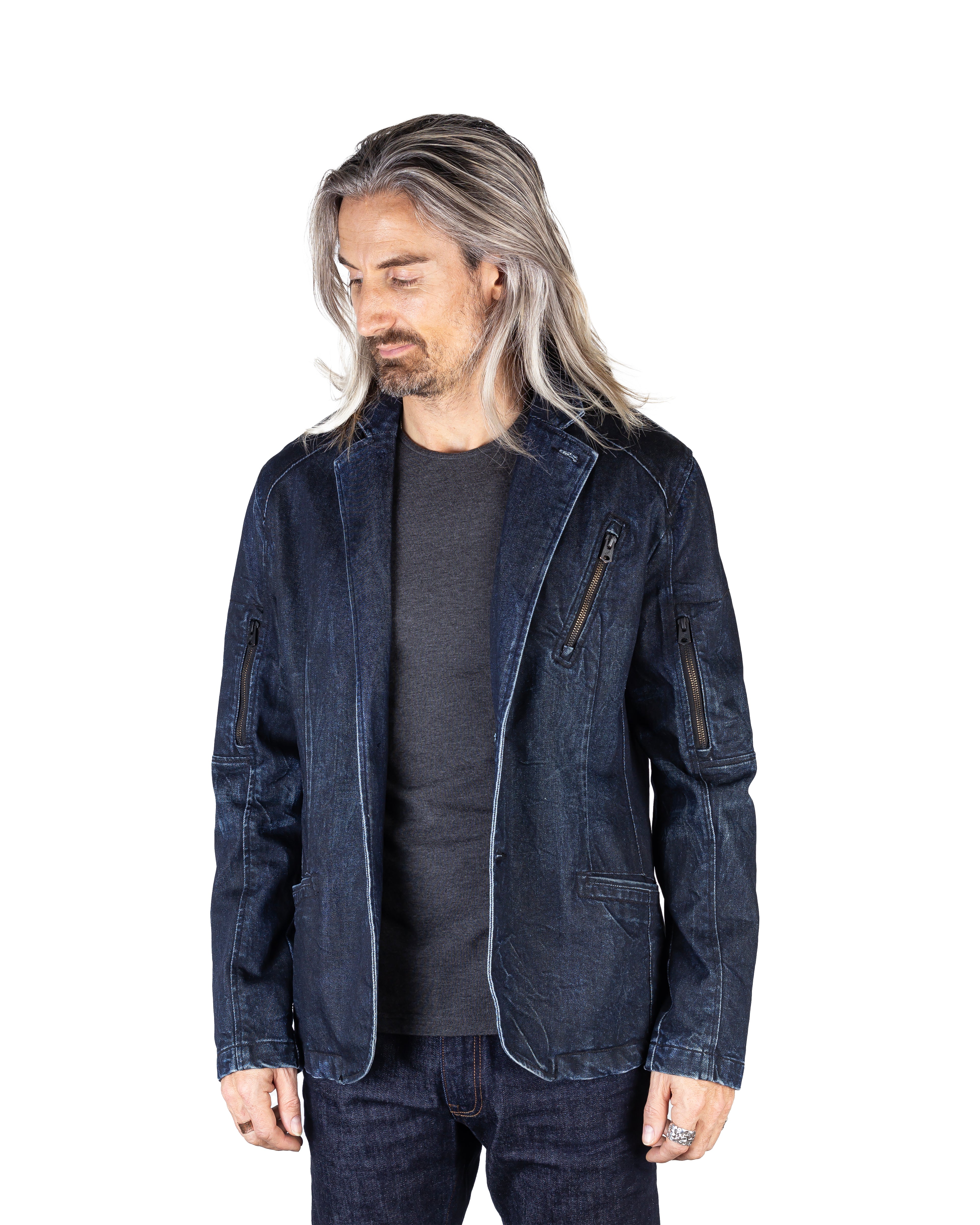 Model wearing the Engineered Slim Denim Jacket in Zip Ice, front-facing, showcasing its signature raw ice finish and bold black metal zippers.