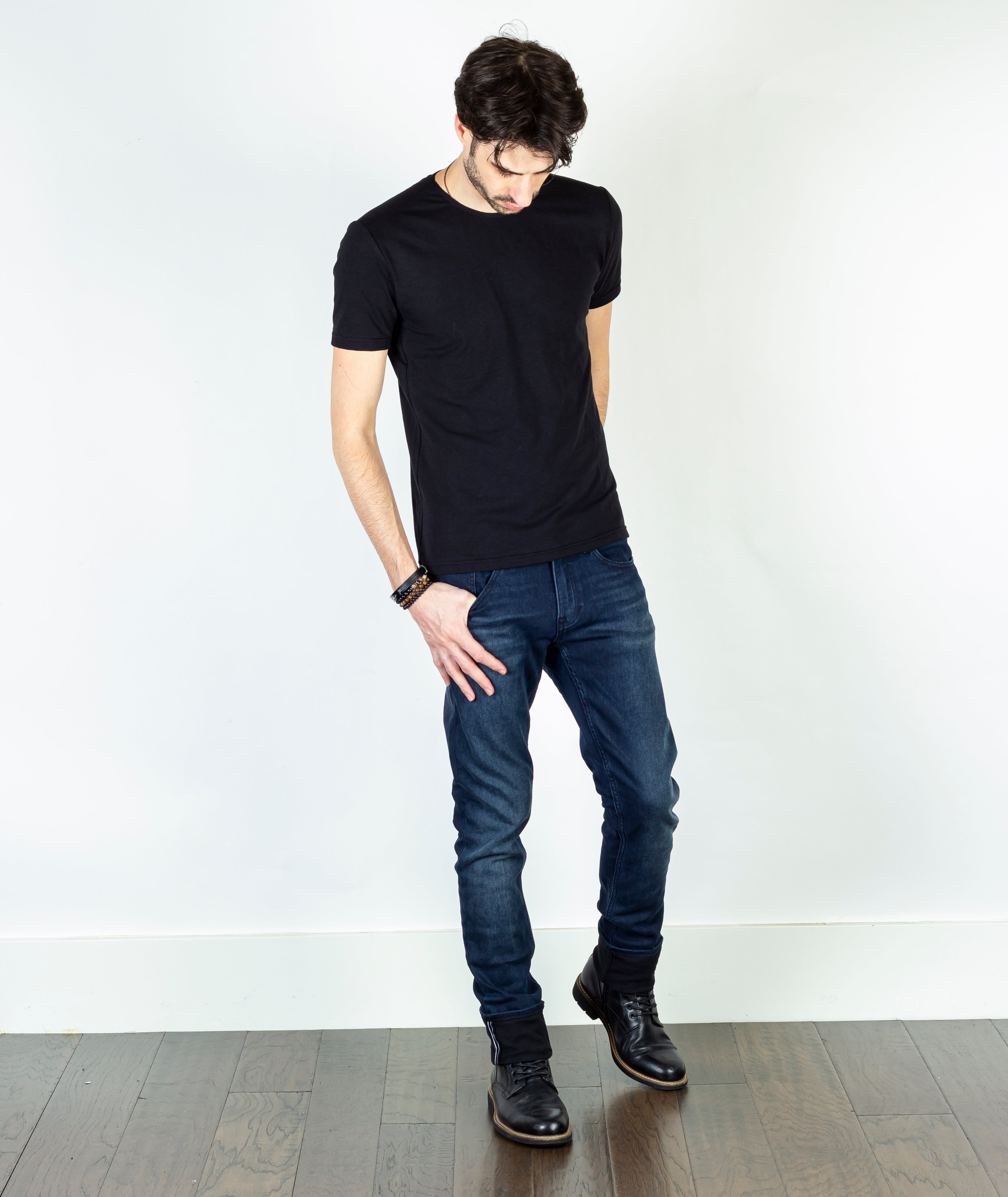 Model wearing Axe Noche Slim Straight Comfort Fit Jeans, front view, showcasing the sleek fit and premium craftsmanship of the jeans.